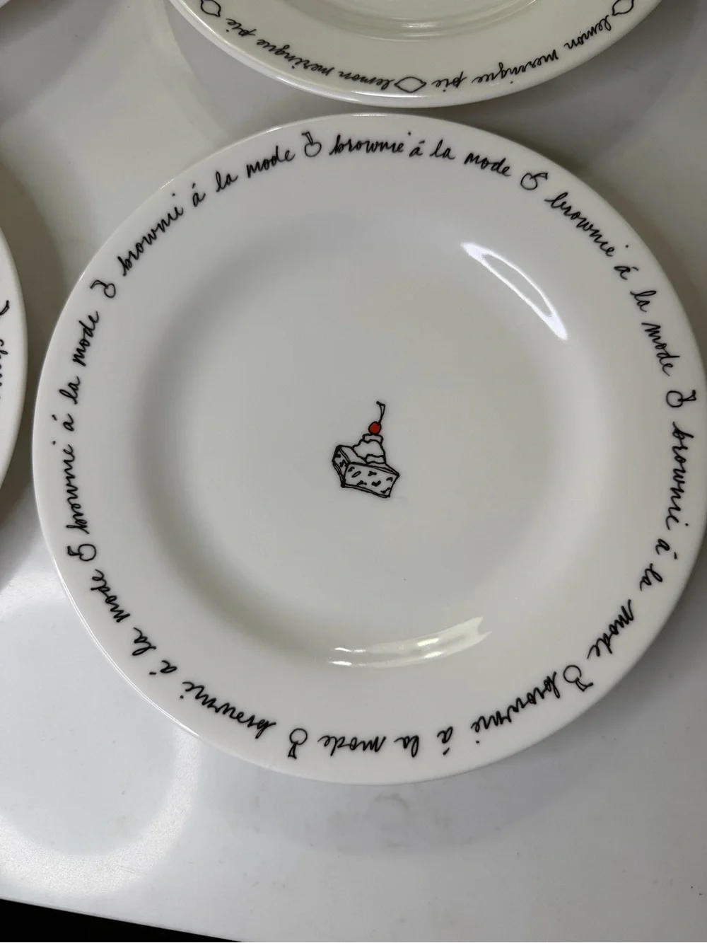 Pottery Barn porcelain Dessert Plates – White with Black Script and Cake Motifs